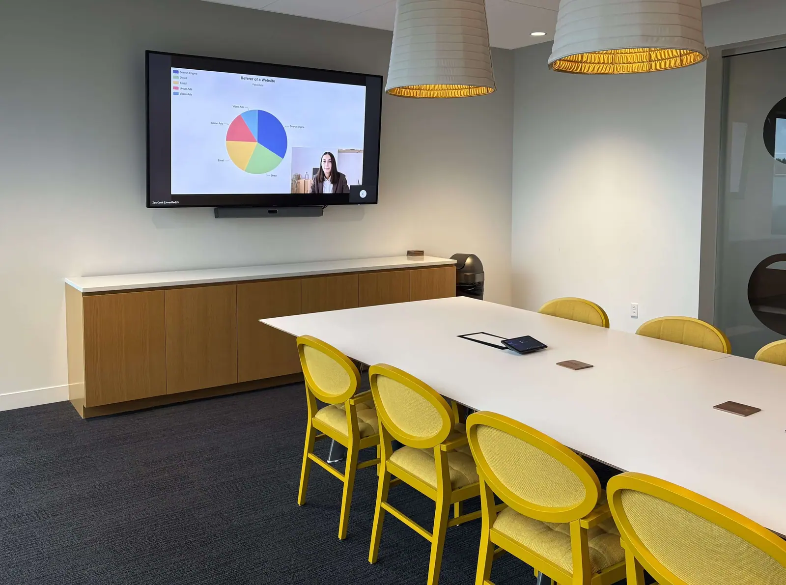 Conference room installed by River Systems with wall display and video call running